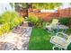 Backyard featuring a walkway, lush landscaping, and seating area at 2501 Emerson S Ave, St Petersburg, FL 33712