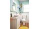 Stylish bathroom with a modern vanity, vessel sink, unique decor, and a bright yellow rug at 2501 Emerson S Ave, St Petersburg, FL 33712
