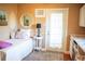 Charming bedroom with a single bed, small table, and natural light from the door and decorated with a vanity area at 2501 Emerson S Ave, St Petersburg, FL 33712