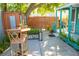 Charming patio featuring a bistro set, a well-manicured garden and a cozy, private outdoor space at 2501 Emerson S Ave, St Petersburg, FL 33712