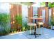Quaint patio featuring a bistro set, surrounded by lush foliage and creating a cozy outdoor retreat at 2501 Emerson S Ave, St Petersburg, FL 33712