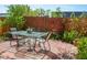 Inviting patio with outdoor dining set and lush greenery, creating a perfect space for entertaining or relaxing at 2501 Emerson S Ave, St Petersburg, FL 33712