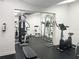 Community fitness center with weight machines, stationary bike and BodyCraft workout bench at 2617 Cove Cay Dr # 108, Clearwater, FL 33760