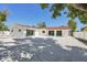 Rear view of a charming house with modern hardscaping and natural light at 2650 E Vina Del Mar Blvd, St Pete Beach, FL 33706