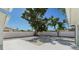 Backyard with modern hardscaping, ample space and fenced perimeter providing privacy at 2650 E Vina Del Mar Blvd, St Pete Beach, FL 33706