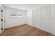 Bright bedroom with hardwood floors, closet, and window for natural light at 2650 E Vina Del Mar Blvd, St Pete Beach, FL 33706