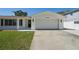 Charming single-story home with a well-kept lawn, attached garage and inviting curb appeal at 2650 E Vina Del Mar Blvd, St Pete Beach, FL 33706