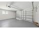 Bright garage with large garage door, gray painted floor, and utility access at 2650 E Vina Del Mar Blvd, St Pete Beach, FL 33706