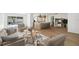 Bright, open-concept living room with stylish furniture and hardwood floors at 2650 E Vina Del Mar Blvd, St Pete Beach, FL 33706