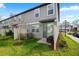 Backyard view with a grassy area, a patio with seating, and a fence at 2760 Scarlet Bay Pl, Brandon, FL 33510