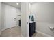 Powder bathroom features a blue vanity with white countertops and modern fixtures at 2760 Scarlet Bay Pl, Brandon, FL 33510