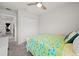 A cozy bedroom with carpeted floors and a closet featuring sliding doors for seamless storage at 2760 Scarlet Bay Pl, Brandon, FL 33510