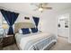 Spacious bedroom featuring ceiling fan, carpet, and stylish furnishings at 2760 Scarlet Bay Pl, Brandon, FL 33510