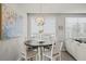 Cozy dining area with a modern light fixture and view of the living room at 2760 Scarlet Bay Pl, Brandon, FL 33510