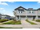 Charming two-story townhome with gray siding and a well-manicured front lawn at 2760 Scarlet Bay Pl, Brandon, FL 33510