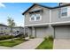 Close up of a charming two-story townhome with gray siding and an attached garage at 2760 Scarlet Bay Pl, Brandon, FL 33510