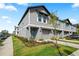 Charming townhome exterior with manicured landscaping, attached garage, and a welcoming blue door at 2760 Scarlet Bay Pl, Brandon, FL 33510