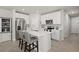 Bright kitchen features stainless appliances, center island with seating and stylish white cabinetry at 2760 Scarlet Bay Pl, Brandon, FL 33510