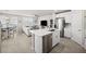 Bright, open-concept living area with tile floors and stainless steel appliances at 2760 Scarlet Bay Pl, Brandon, FL 33510