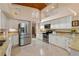 Bright kitchen featuring stainless steel appliances, granite countertops, and ample white cabinetry at 2796 St Andrews Blvd, Tarpon Springs, FL 34688