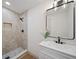 Modern bathroom featuring a stylish shower, vanity, and contemporary finishes at 2930 W Arch St, Tampa, FL 33607