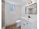 Bathroom featuring a modern vanity, black hardware and tiled shower at 2930 W Arch St, Tampa, FL 33607