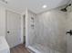 Modern bathroom with a tiled shower and dark fixtures at 2930 W Arch St, Tampa, FL 33607