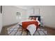 Comfortable bedroom featuring a cozy bed with stylish bedding and lots of natural light at 2930 W Arch St, Tampa, FL 33607