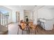 Bright dining area featuring a glass table with seating for four and a breakfast bar at 2930 W Arch St, Tampa, FL 33607