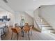 Dining room featuring stylish chairs and table, wood floors, and easy access to the kitchen and living areas at 2930 W Arch St, Tampa, FL 33607