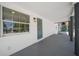 Inviting front porch showcasing a decorative door and window allowing ample natural light at 2930 W Arch St, Tampa, FL 33607