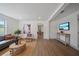 Comfortable living room featuring wood floors, modern furnishings, and an open layout at 2930 W Arch St, Tampa, FL 33607