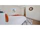 This main bedroom features an area rug, wood-look floors, and bright natural light at 2930 W Arch St, Tampa, FL 33607