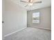 Bedroom with neutral walls, carpet, ceiling fan, and a window at 3629 Bellmeade Ct, Wesley Chapel, FL 33543