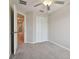 The bedroom features neutral walls, plush carpet, and ample closet space at 3629 Bellmeade Ct, Wesley Chapel, FL 33543