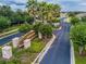 Elegant gated community entrance with manicured landscaping and signage at 3629 Bellmeade Ct, Wesley Chapel, FL 33543