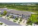 Street view of modern townhomes featuring multi-car garages and manicured landscaping at 3629 Bellmeade Ct, Wesley Chapel, FL 33543