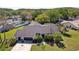 Aerial view of a lovely home with lush greenery, mature trees, and a private backyard oasis at 3994 Belmoor Dr, Palm Harbor, FL 34685