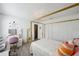 Bedroom featuring a four-poster bed, chandelier, and wood-look floors at 3994 Belmoor Dr, Palm Harbor, FL 34685