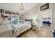 Comfortable bedroom with built-in shelving and direct access to the home's dining room at 3994 Belmoor Dr, Palm Harbor, FL 34685