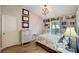 Cozy bedroom with built-in bookshelves, a patterned bedspread, and natural light at 3994 Belmoor Dr, Palm Harbor, FL 34685