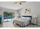 Spacious main bedroom with a view of the private pool and patio area at 3994 Belmoor Dr, Palm Harbor, FL 34685