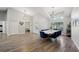 Elegant dining room boasts high ceilings, modern lighting, and a stylish white table with blue chairs at 3994 Belmoor Dr, Palm Harbor, FL 34685