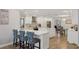 Spacious kitchen featuring a large island with white countertops and modern appliances at 3994 Belmoor Dr, Palm Harbor, FL 34685
