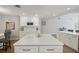 Bright kitchen with white countertops and cabinets offering a large island and plenty of space at 3994 Belmoor Dr, Palm Harbor, FL 34685