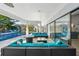 Inviting lanai features an outdoor seating area with a view of the pool and a screened enclosure at 3994 Belmoor Dr, Palm Harbor, FL 34685