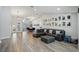 Open living space with sleek flooring, modern lighting, and an adjacent dining area perfect for gatherings at 3994 Belmoor Dr, Palm Harbor, FL 34685