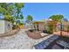 Well maintained backyard with stone pavers, red flowers, wooden fence and shed at 4509 10Th N Ave, St Petersburg, FL 33713