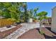 Large backyard featuring a firepit, mature trees, utility shed and stone pathways at 4509 10Th N Ave, St Petersburg, FL 33713
