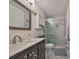 Elegant bathroom featuring marble tile, a modern vanity, and a glass-enclosed shower for a luxurious and relaxing experience at 4509 10Th N Ave, St Petersburg, FL 33713